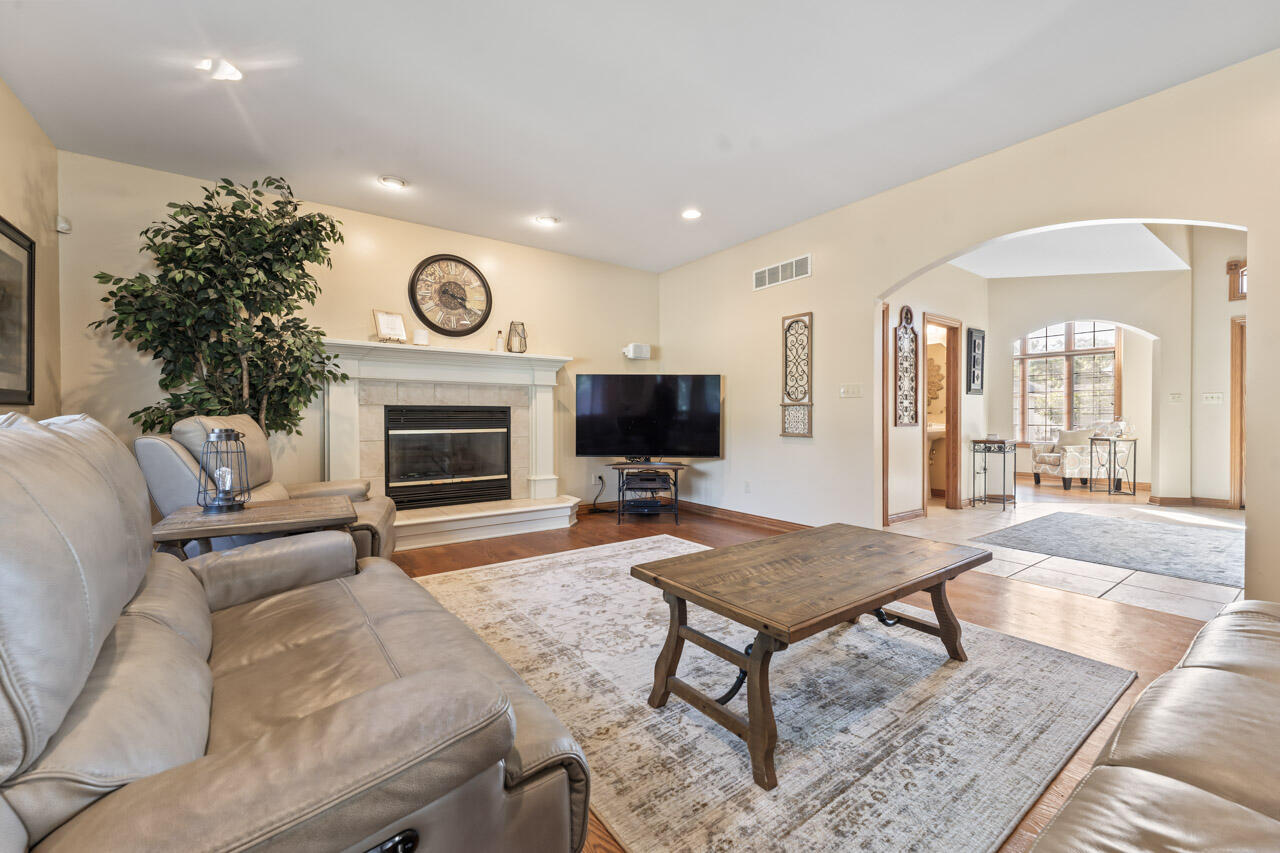 205 North Elgin Street Griffith, IN 46319 - Photo 13 of 43 a living room with furniture a flat screen tv and a fireplace