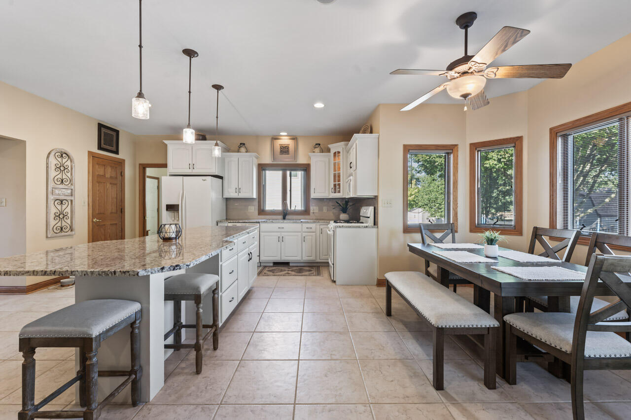 205 North Elgin Street Griffith, IN 46319 - Photo 18 of 43 a large kitchen with cabinets a table and chairs