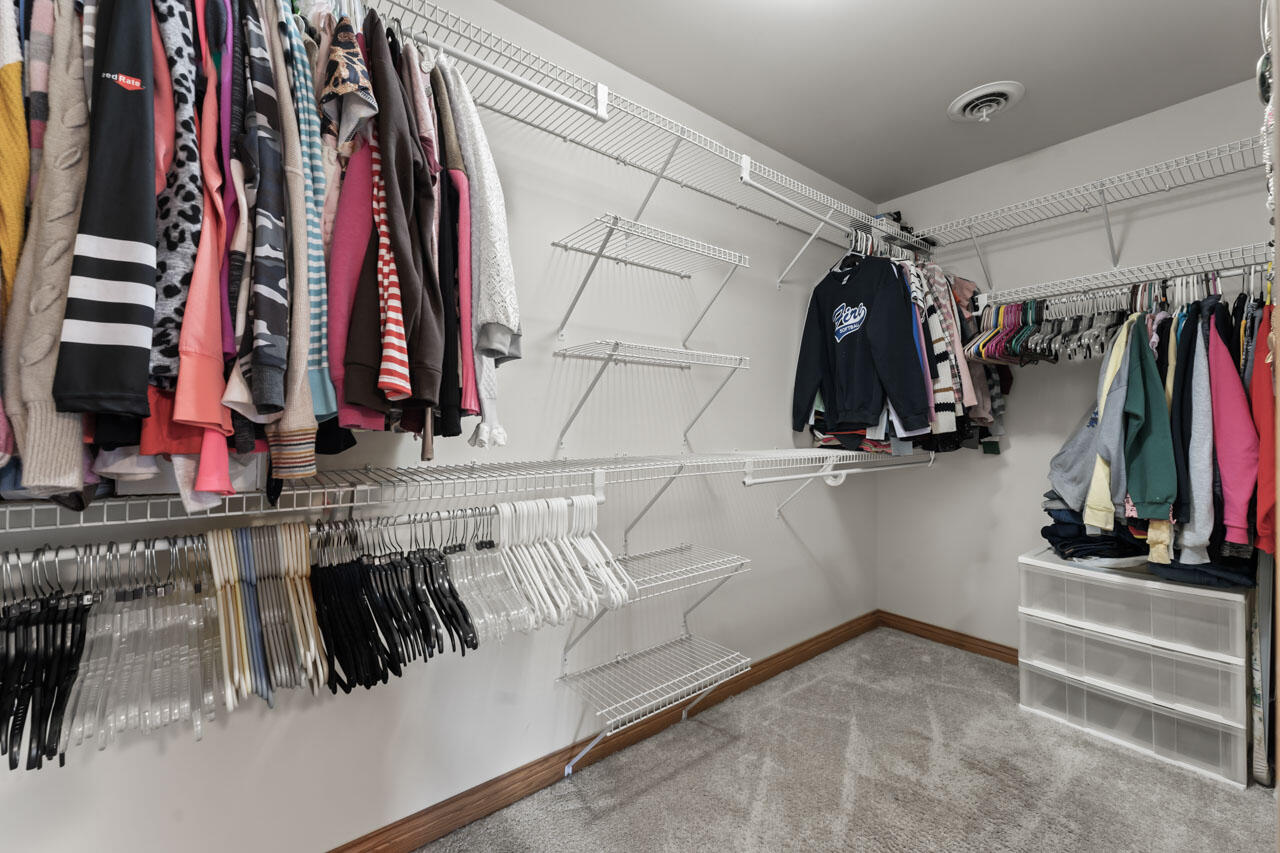 205 North Elgin Street Griffith, IN 46319 - Photo 26 of 43 a view of walk in closet with clothes and shoes