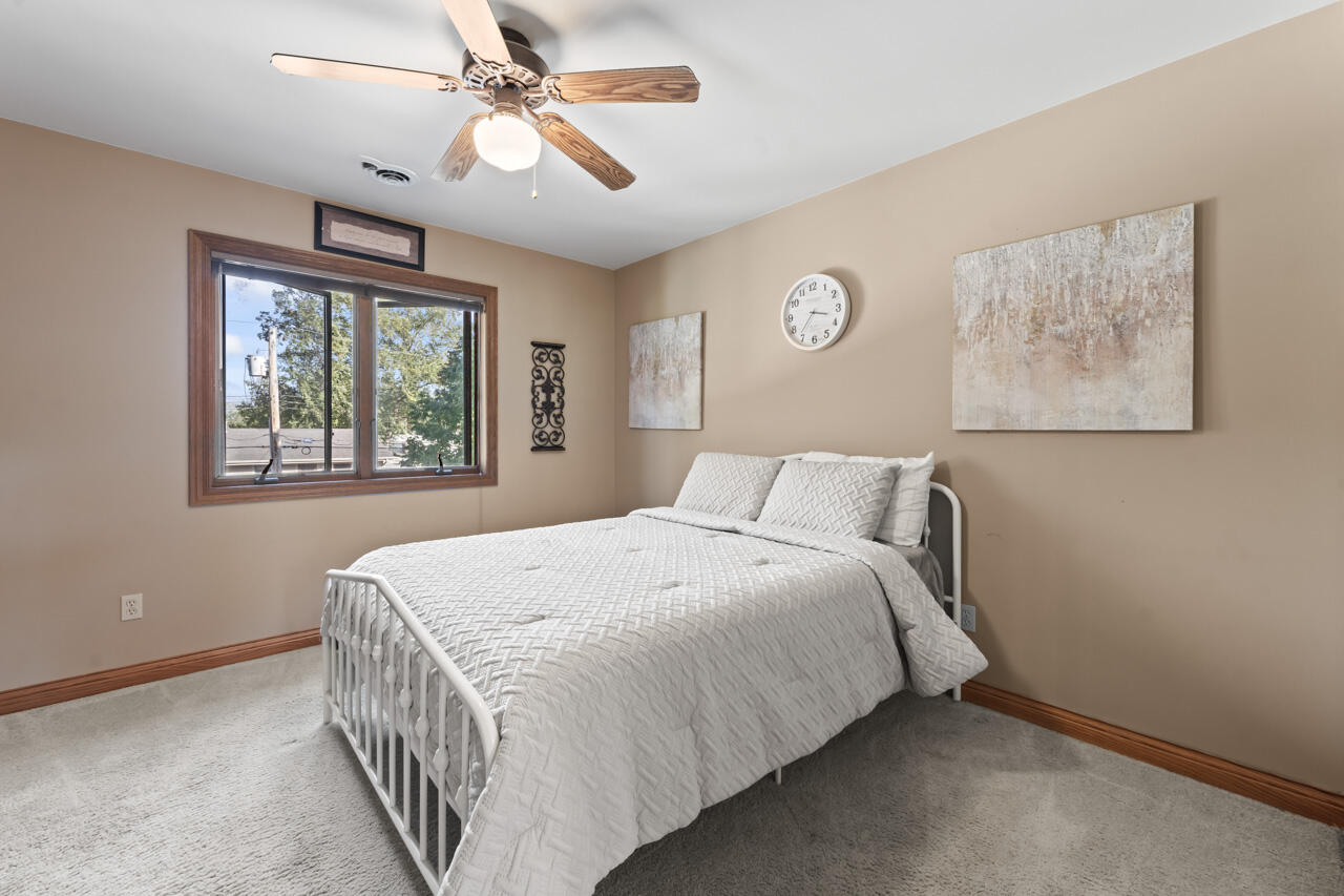 205 North Elgin Street Griffith, IN 46319 - Photo 28 of 43 a bedroom with a bed and a window