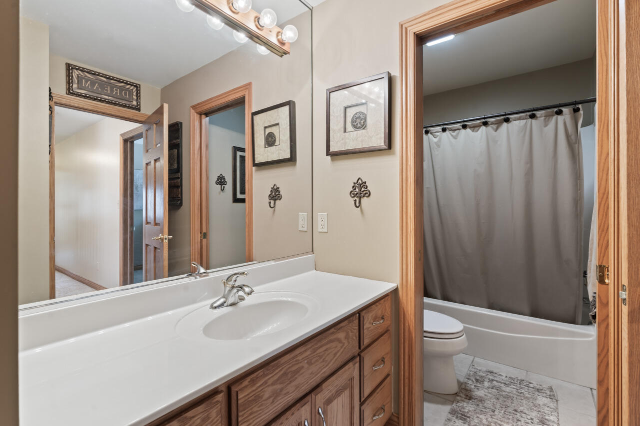 205 North Elgin Street Griffith, IN 46319 - Photo 29 of 43 a bathroom with a sink a toilet and shower