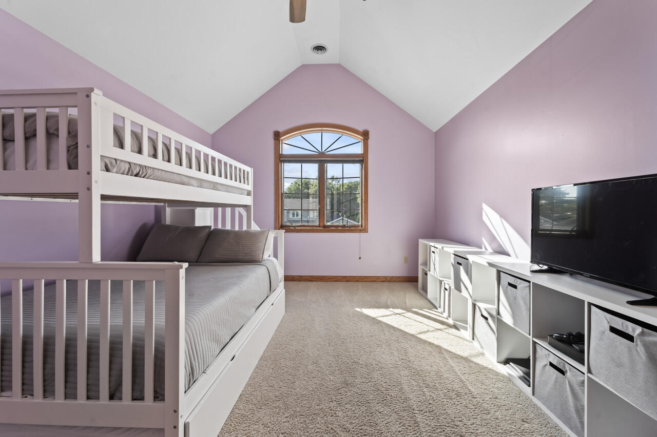 205 North Elgin Street Griffith, IN 46319 - Photo 30 of 43 a bedroom with furniture and flat screen tv