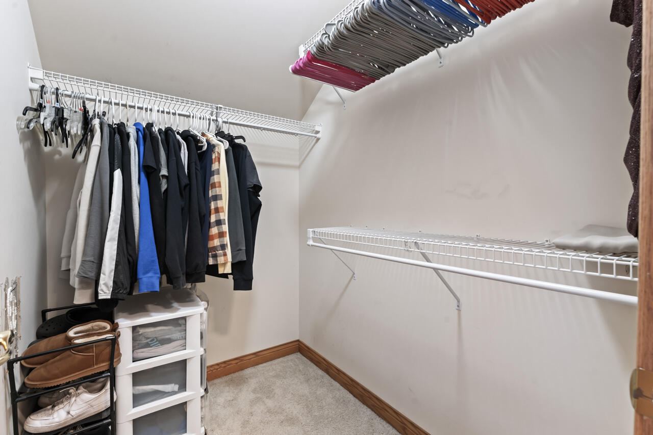 205 North Elgin Street Griffith, IN 46319 - Photo 31 of 43 a view of walk in closet with clothes