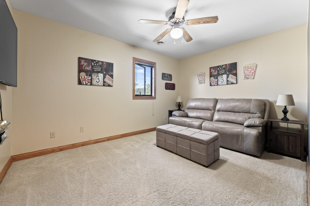 205 North Elgin Street Griffith, IN 46319 - Photo 32 of 43 a living room with furniture and a ceiling fan