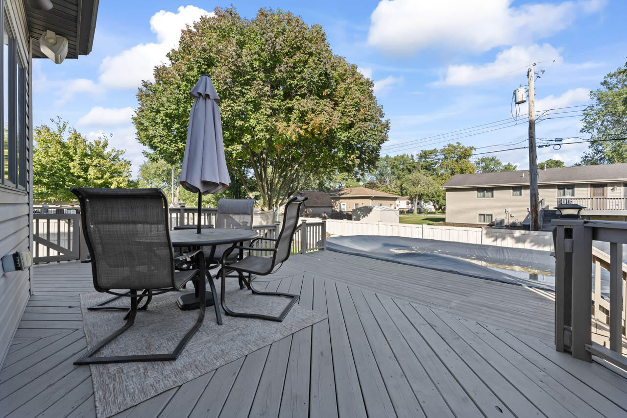 205 North Elgin Street Griffith, IN 46319 - Photo 34 of 43 a view of balcony with chairs and wooden floor