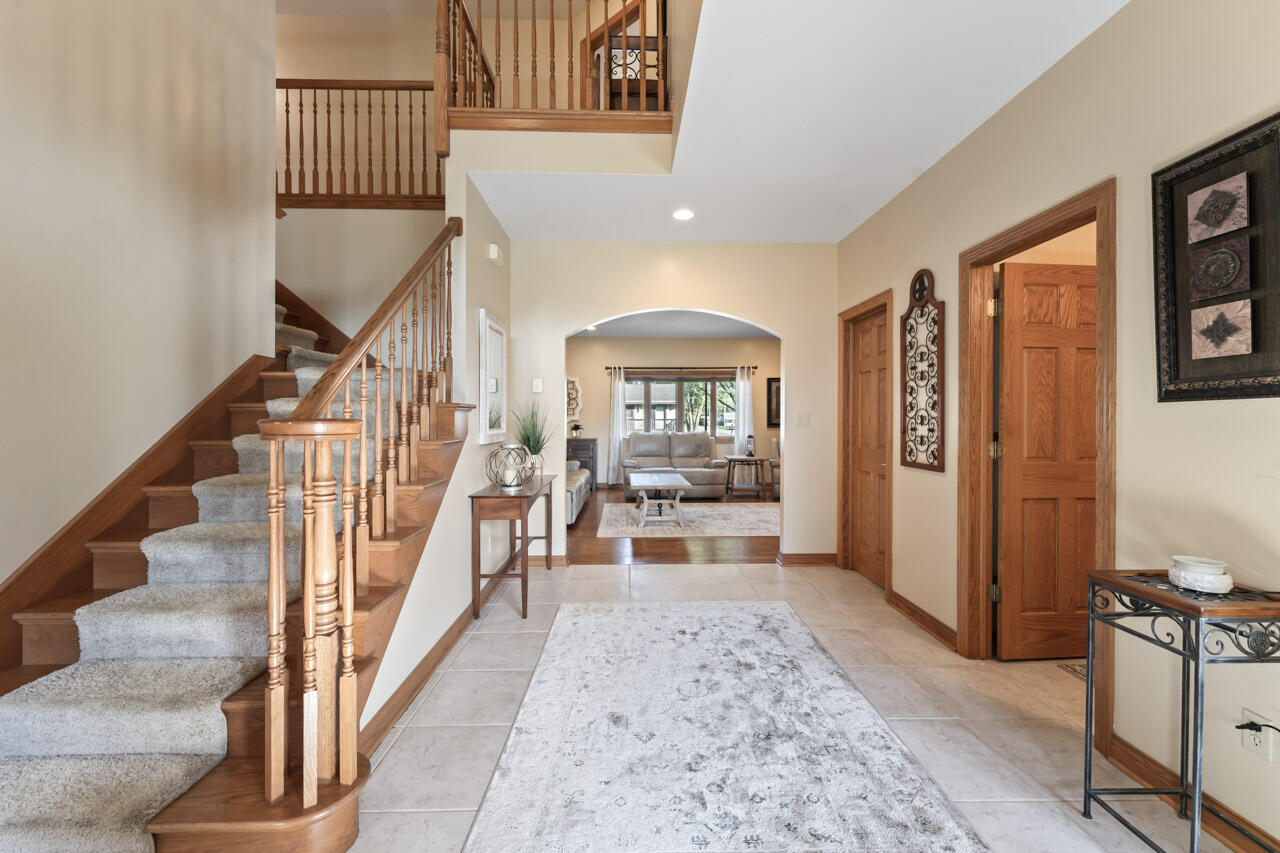 205 North Elgin Street Griffith, IN 46319 - Photo 4 of 43 a view of a hallway with wooden floor and entryway