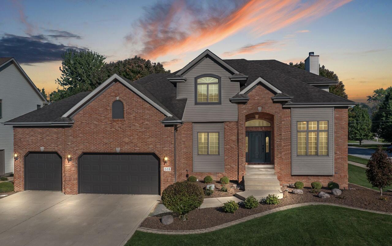 205 North Elgin Street Griffith, IN 46319 - Photo 43 of 43 a front view of a house with a garden and plants