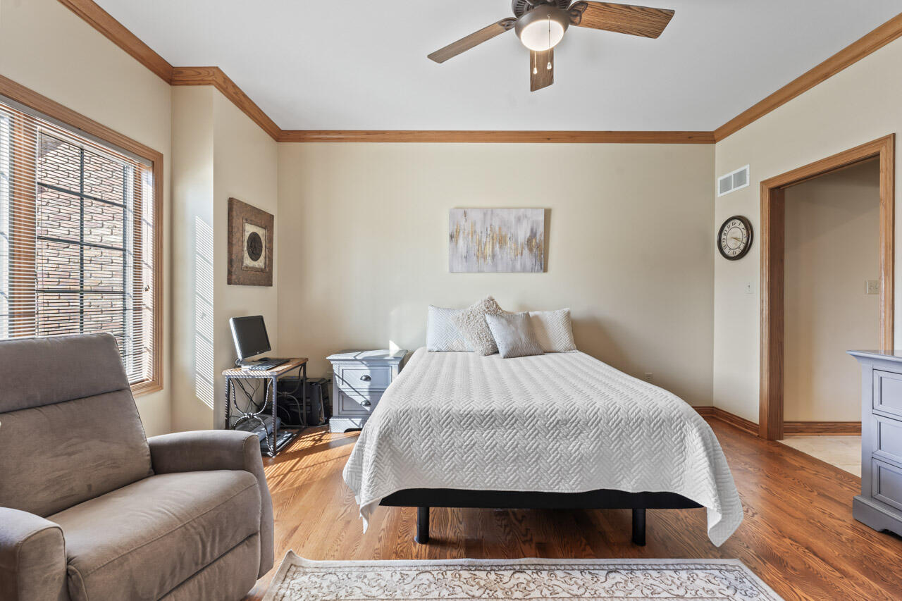 205 North Elgin Street Griffith, IN 46319 - Photo 10 of 43 a bedroom with a bed couch and a window