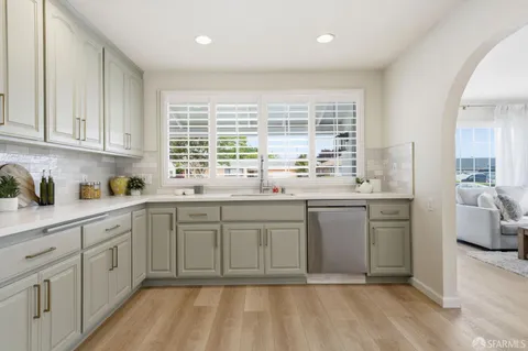 a kitchen with a sink and cabinets