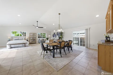 a dining room with furniture and window