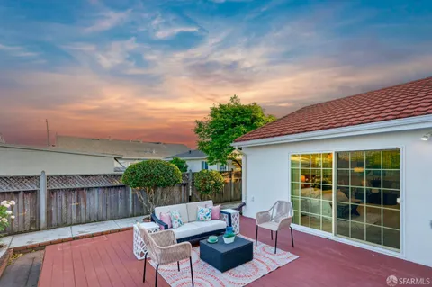 a view of a two chairs in the patio