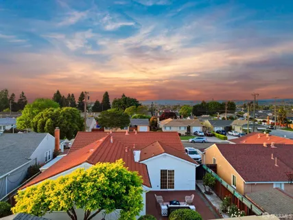 a view of a houses with a city street