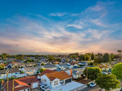 an aerial view of a city with lots of residential buildings