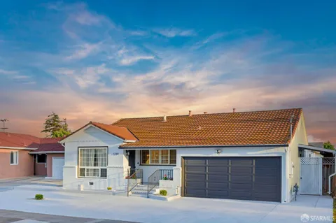 a front view of a house with a garage