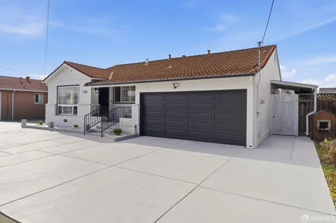 a front view of a house with a garage