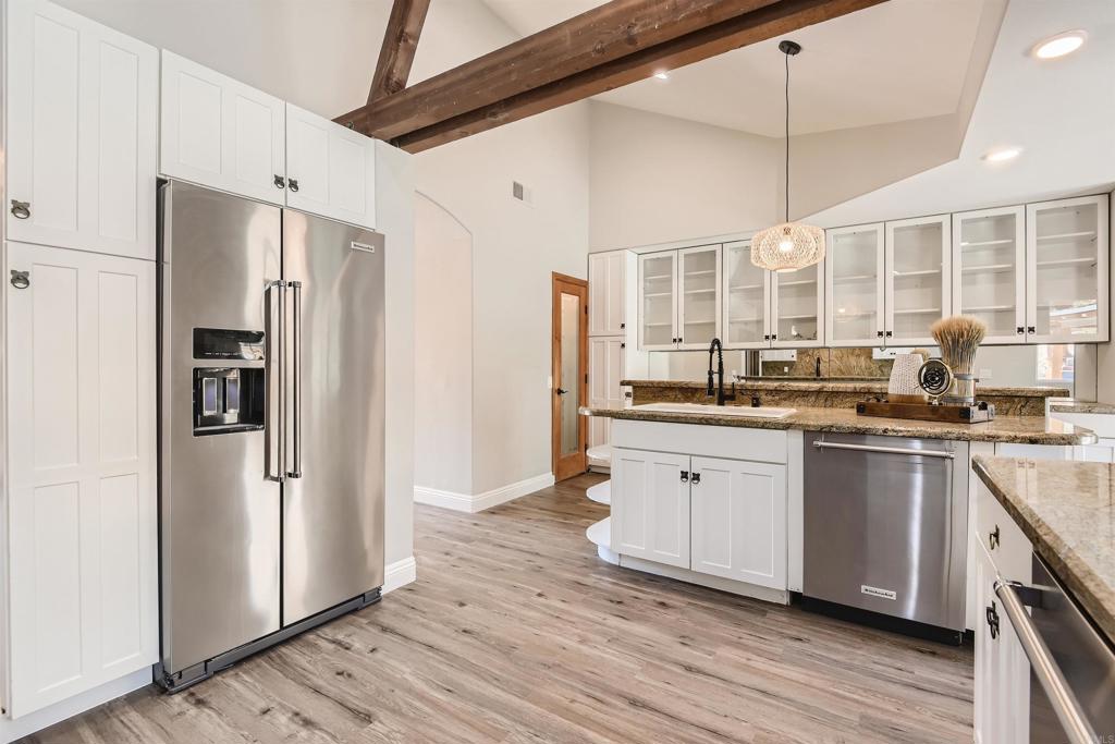 808 Hitching Post Road Vista, CA 92081 - Photo 13 of 29 a kitchen with stainless steel appliances a refrigerator sink and cabinets
