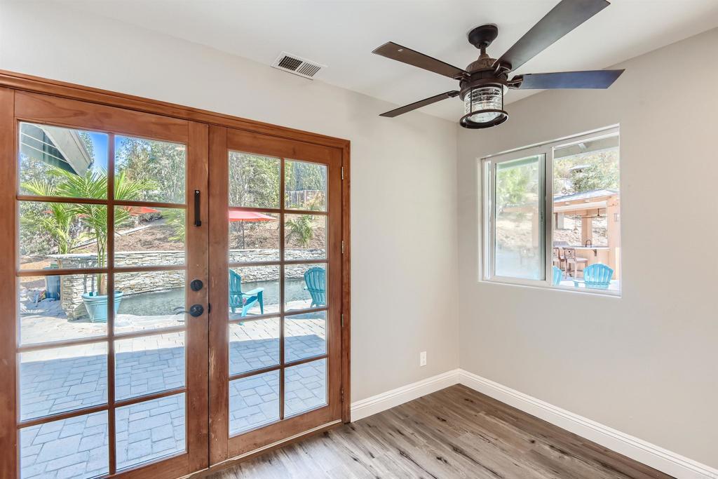 808 Hitching Post Road Vista, CA 92081 - Photo 15 of 29 a view of a livingroom with a ceiling fan and a large window