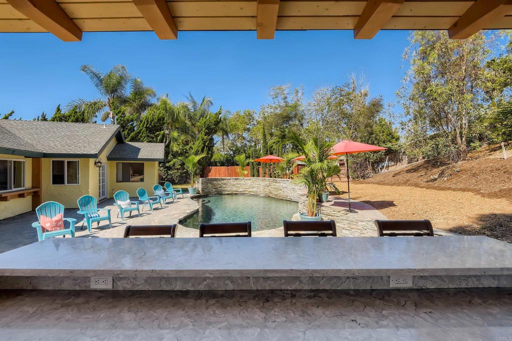 808 Hitching Post Road Vista, CA 92081 - Photo 27 of 29 a wooden bench sitting in front of a building