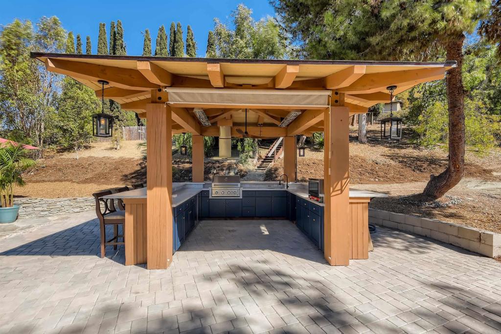 808 Hitching Post Road Vista, CA 92081 - Photo 28 of 29 a view of a patio with table and chairs with wooden fence