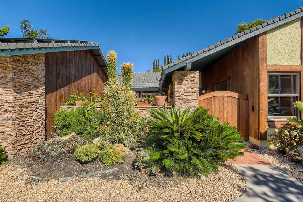 808 Hitching Post Road Vista, CA 92081 - Photo 5 of 29 a front view of a house with garden