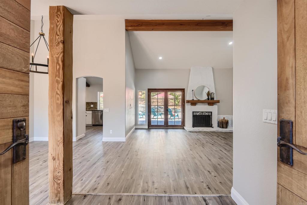 808 Hitching Post Road Vista, CA 92081 - Photo 7 of 29 a view of a kitchen with furniture and wooden floor