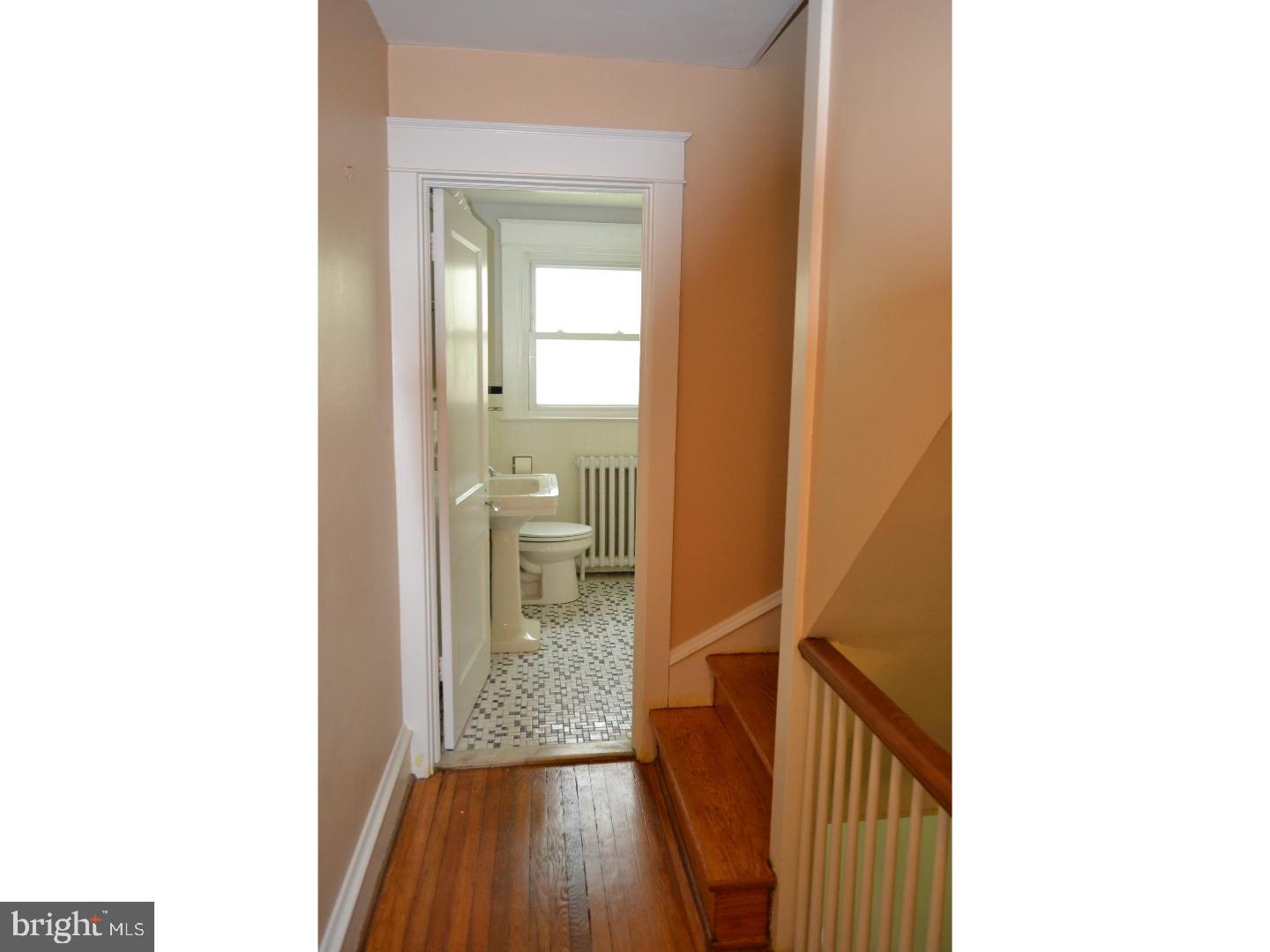 129 Walsh Road Lansdowne, PA 19050 - Photo 15 of 25 a view of a room with a hardwood floor and a hallway