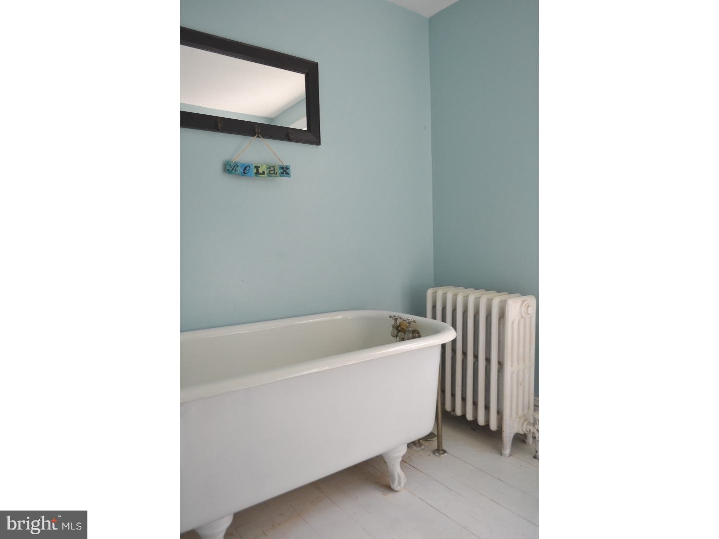 129 Walsh Road Lansdowne, PA 19050 - Photo 22 of 25 a bathroom with a bathtub and a sink