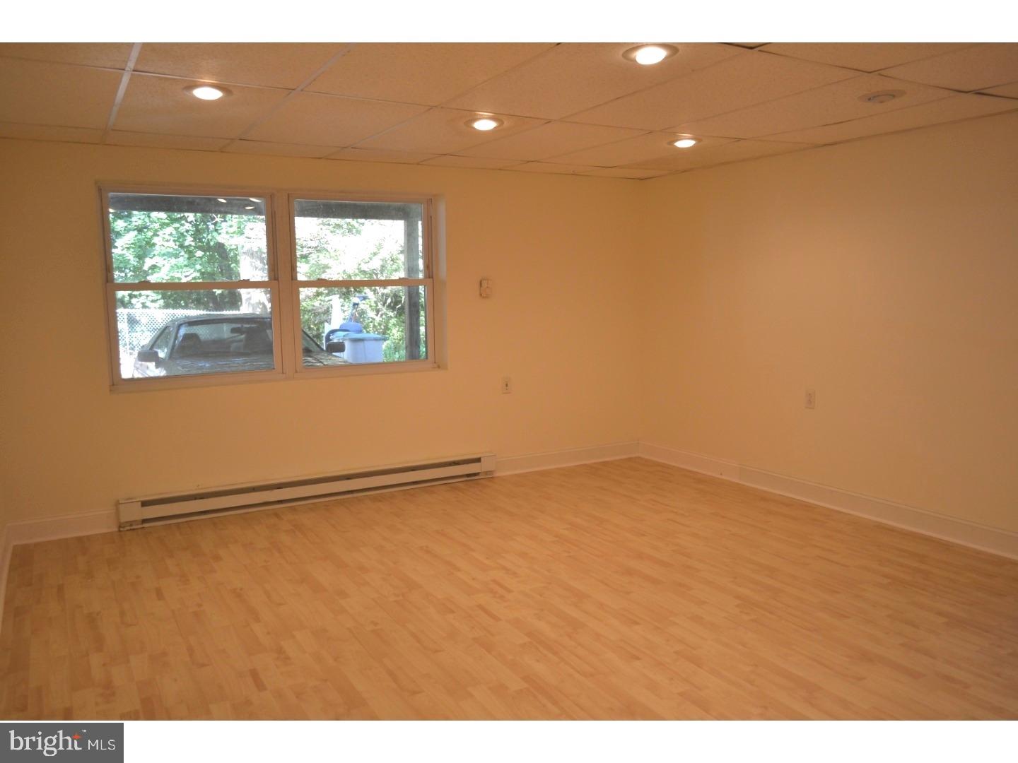 129 Walsh Road Lansdowne, PA 19050 - Photo 23 of 25 a view of an empty room with a window