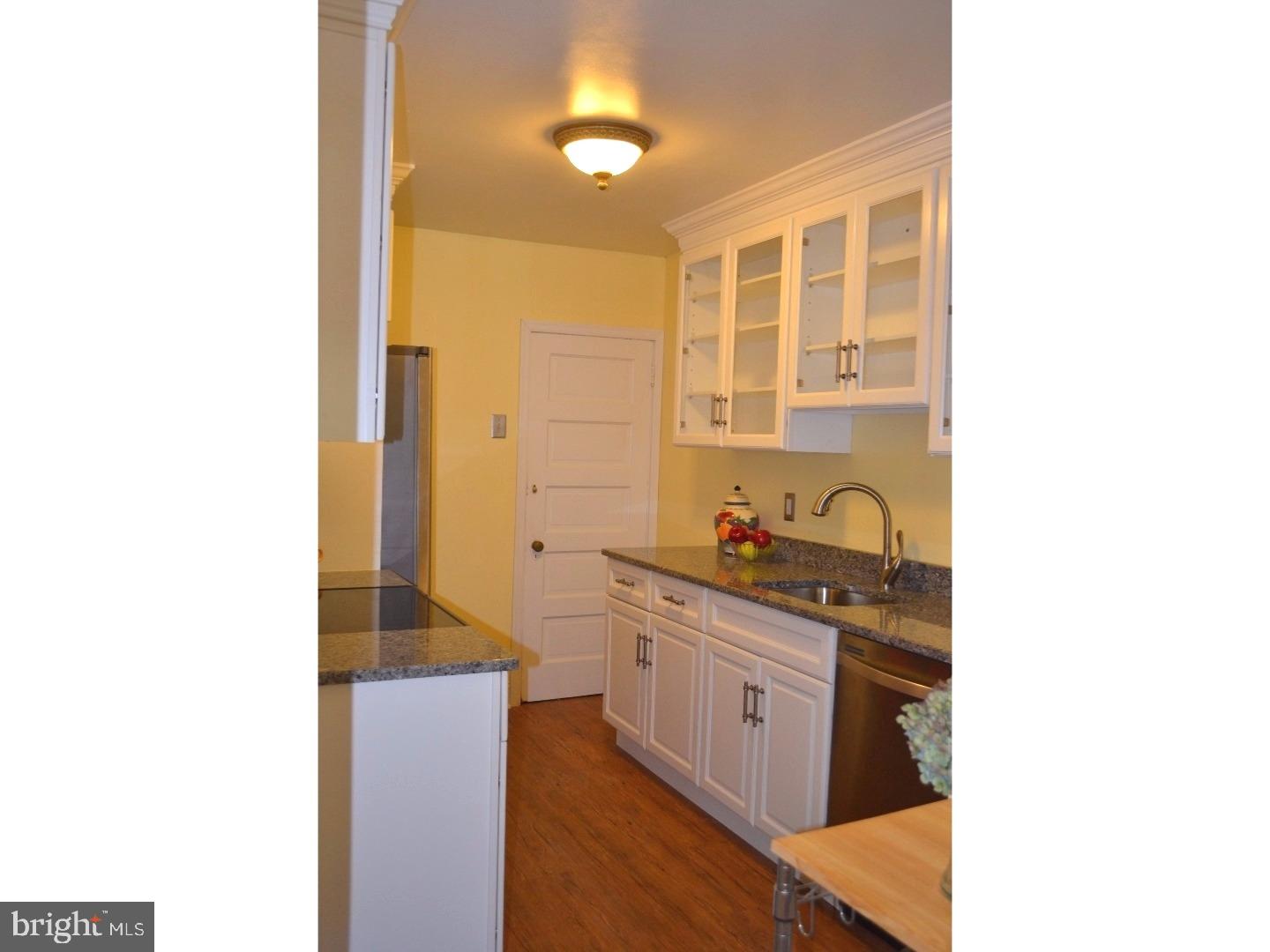 129 Walsh Road Lansdowne, PA 19050 - Photo 8 of 25 a kitchen with stainless steel appliances granite countertop a sink and cabinets
