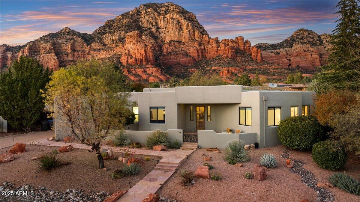 50 Ranch Road Sedona, AZ 86336 - Photo 12 of 51 a view of a house with a yard siting area and garden