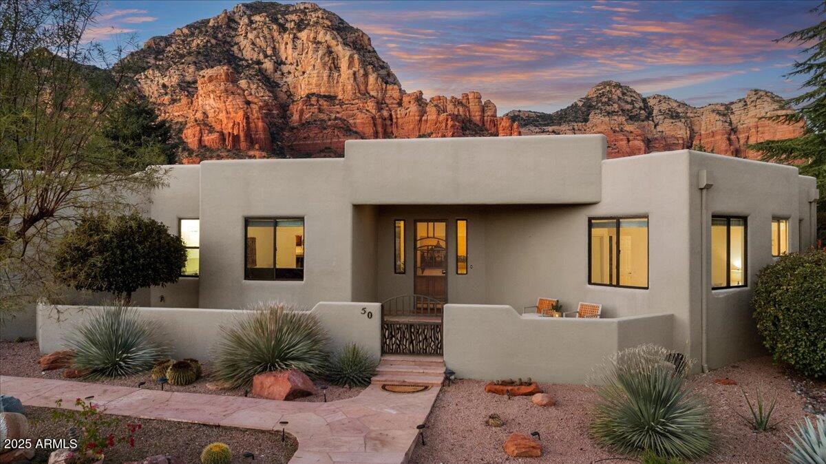 50 Ranch Road Sedona, AZ 86336 - Photo 13 of 51 a view of a patio with couches and potted plants