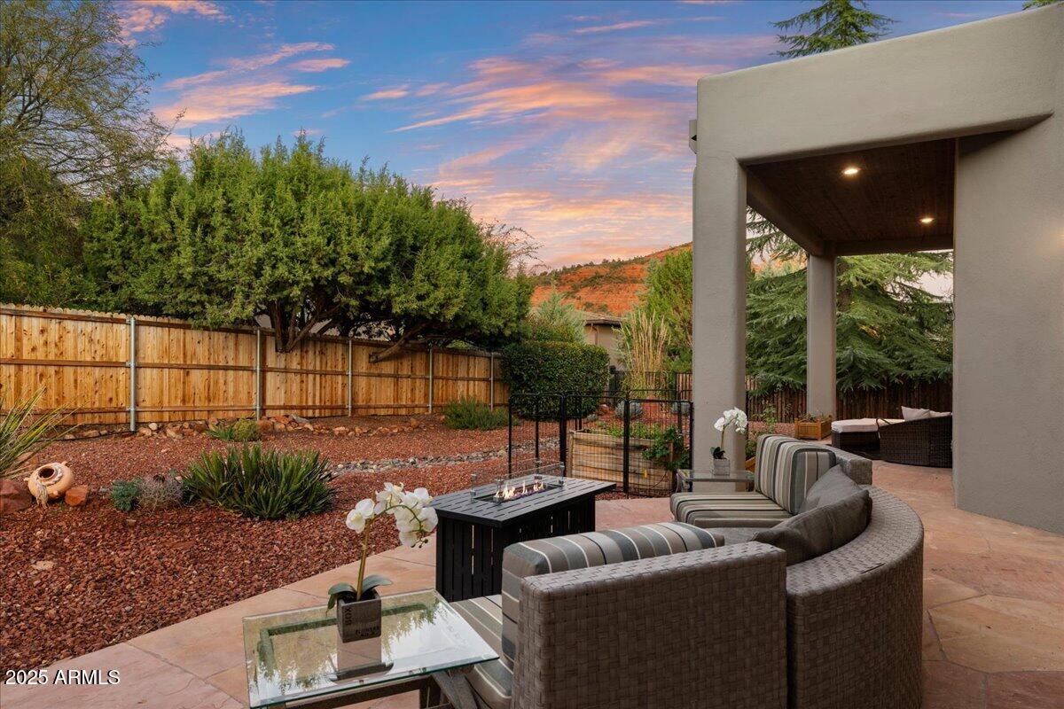 50 Ranch Road Sedona, AZ 86336 - Photo 23 of 51 a view of a patio with couches table and chairs and potted plants