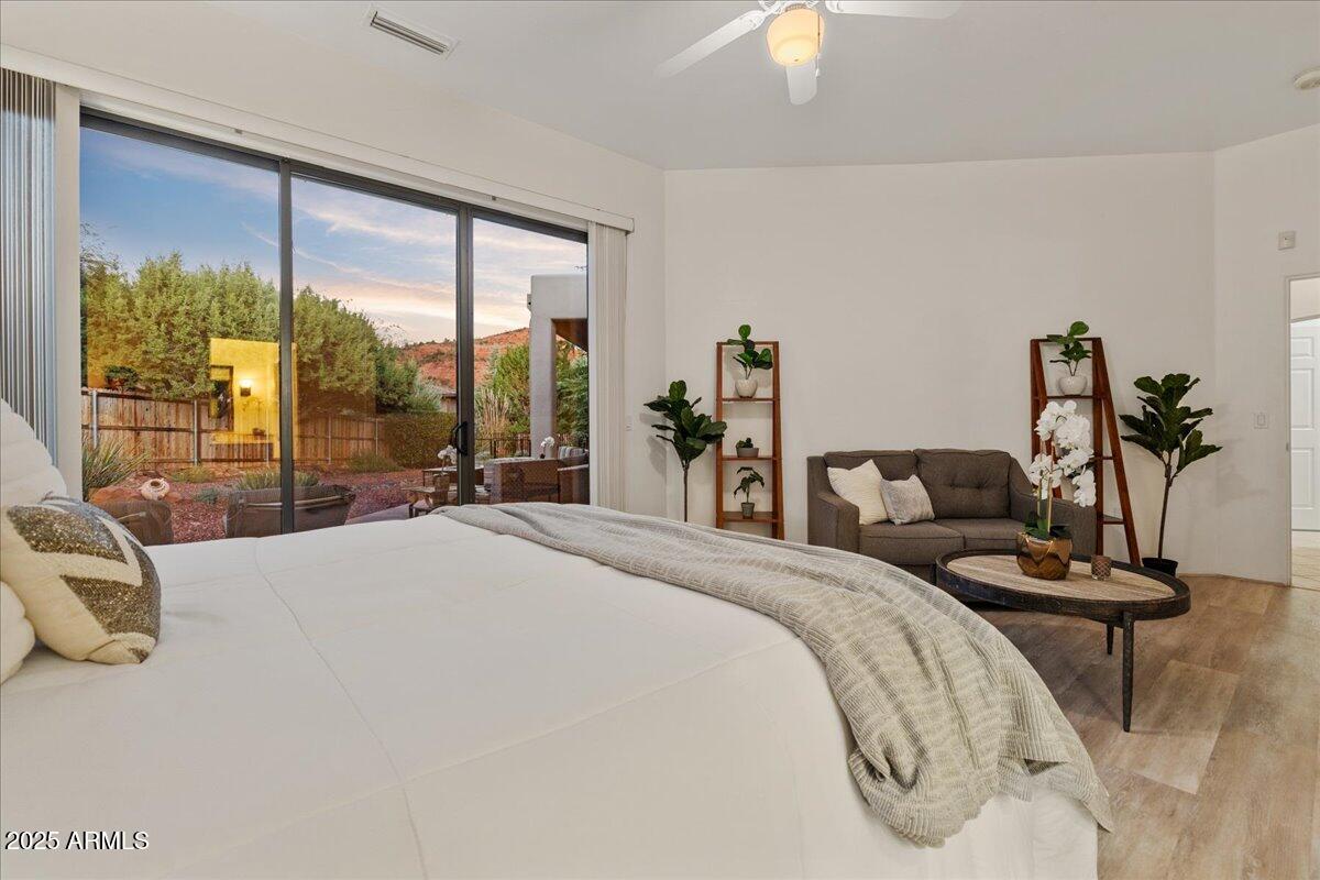 50 Ranch Road Sedona, AZ 86336 - Photo 33 of 51 a bedroom with a bed and large windows
