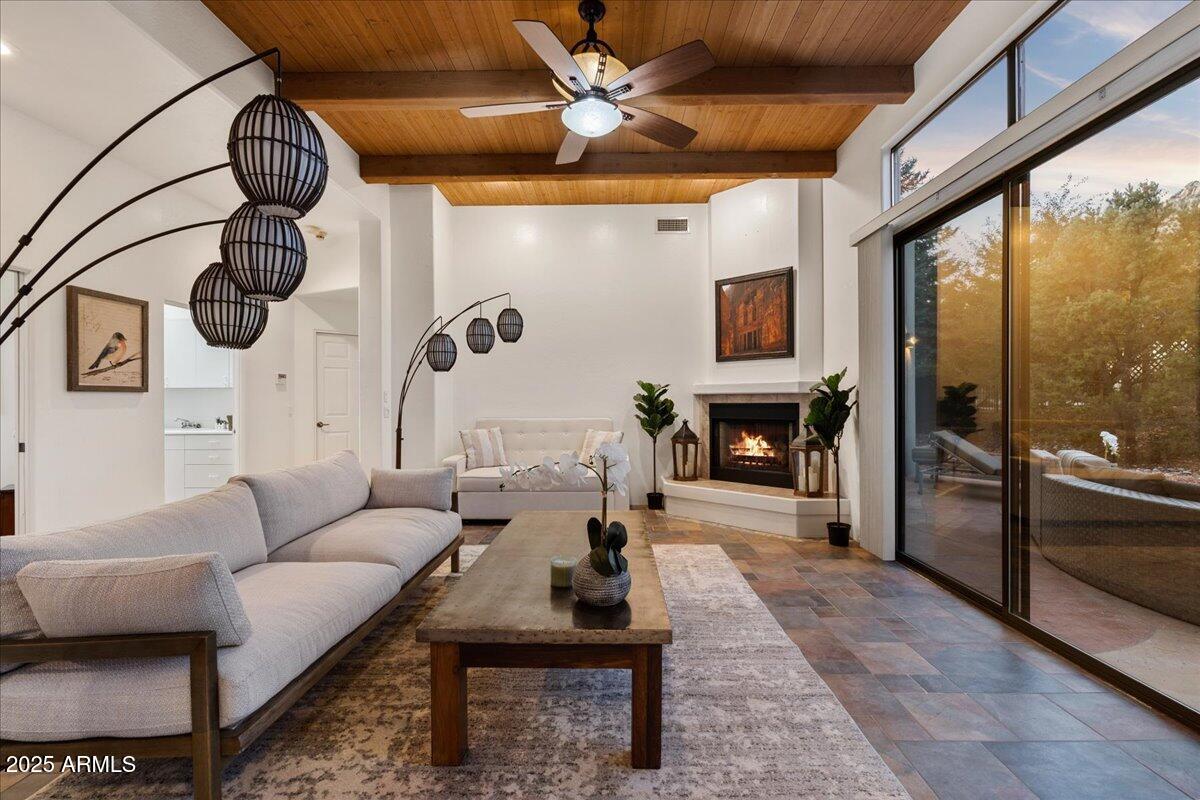 50 Ranch Road Sedona, AZ 86336 - Photo 45 of 51 a living room with furniture a chandelier and a fireplace