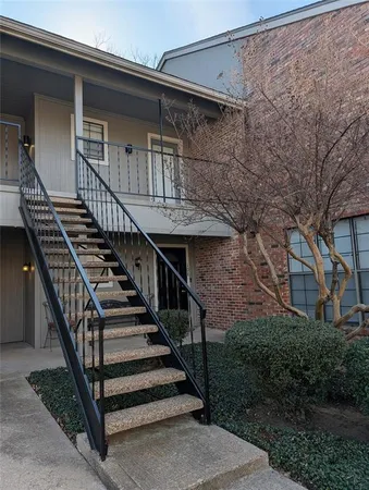 front view of a house with wooden stairs