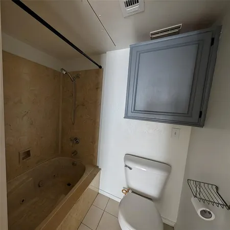 a bathroom with a toilet a sink and bathtub
