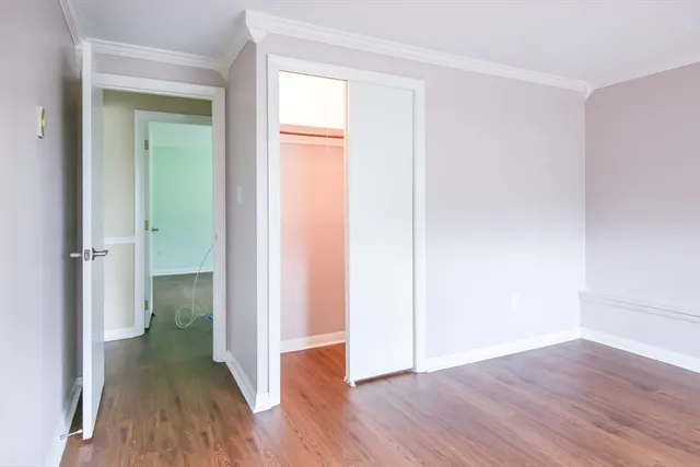 a view of a small space with wooden floor