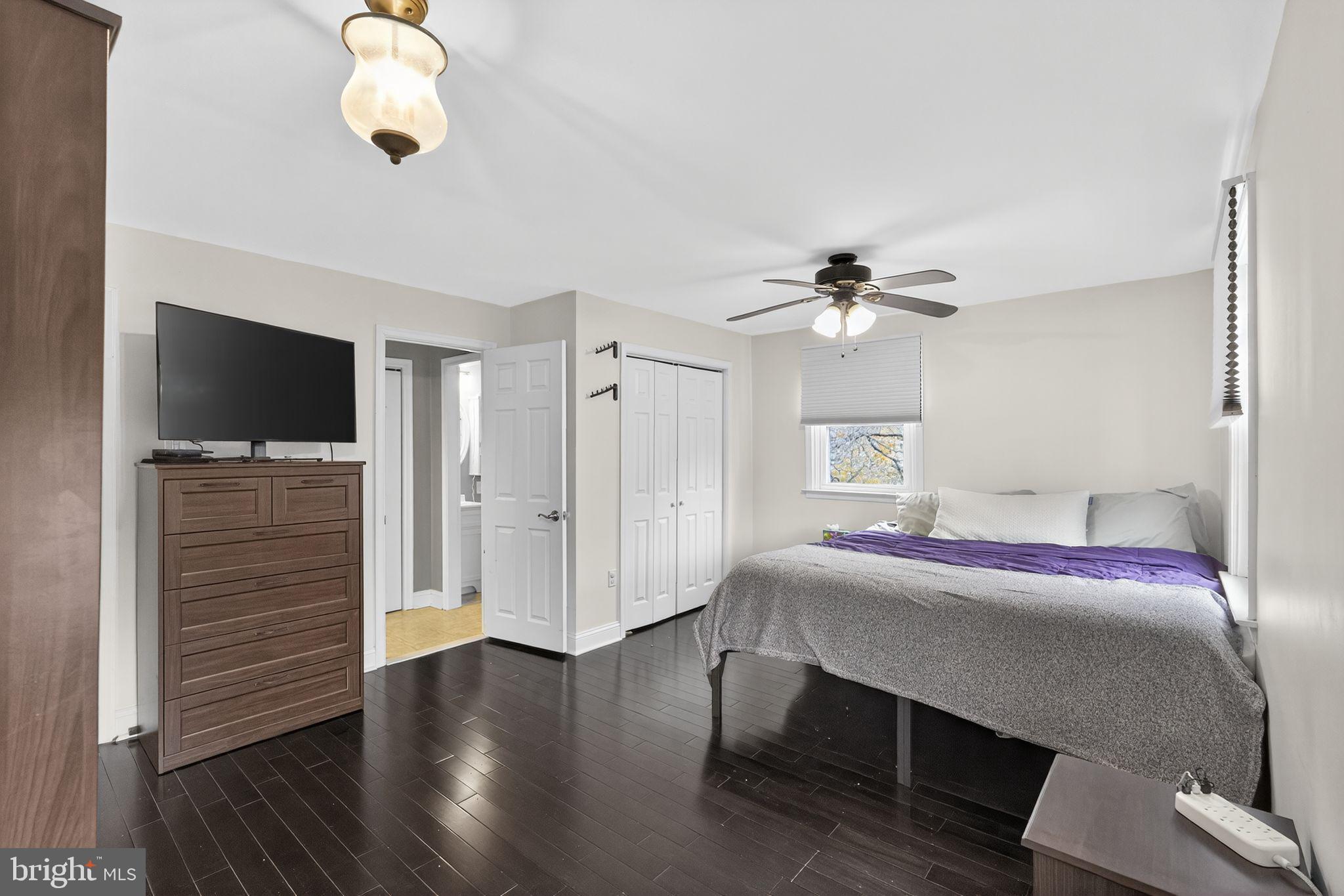 289 Cheswold Road Drexel Hill, PA 19026 - Photo 13 of 29 a bedroom with a bed and wooden floor