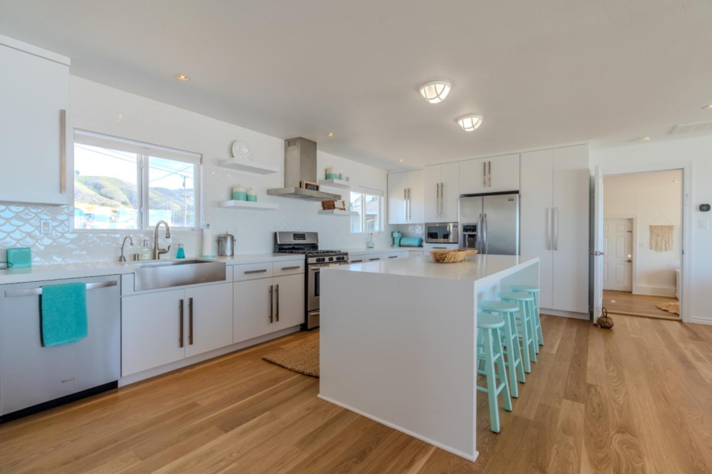236 Shoreview Avenue Pacifica, CA 94044 - Photo 11 of 61 a kitchen with cabinets a counter top space a sink and a refrigerator