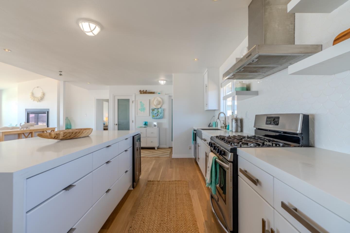 236 Shoreview Avenue Pacifica, CA 94044 - Photo 18 of 61 a kitchen with a sink a counter top space stainless steel appliances and a window