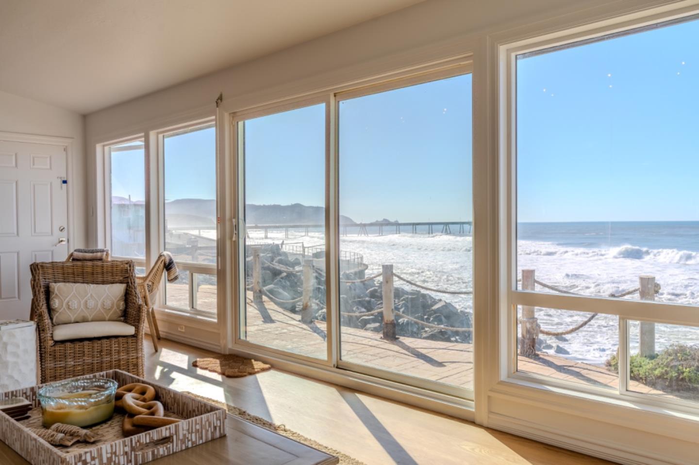 236 Shoreview Avenue Pacifica, CA 94044 - Photo 27 of 61 a living room with furniture and a floor to ceiling window
