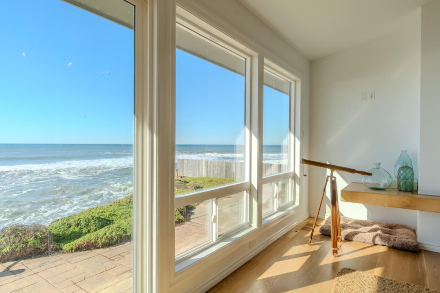 236 Shoreview Avenue Pacifica, CA 94044 - Photo 28 of 61 a view of a living room with a floor to ceiling window and floor to ceiling window