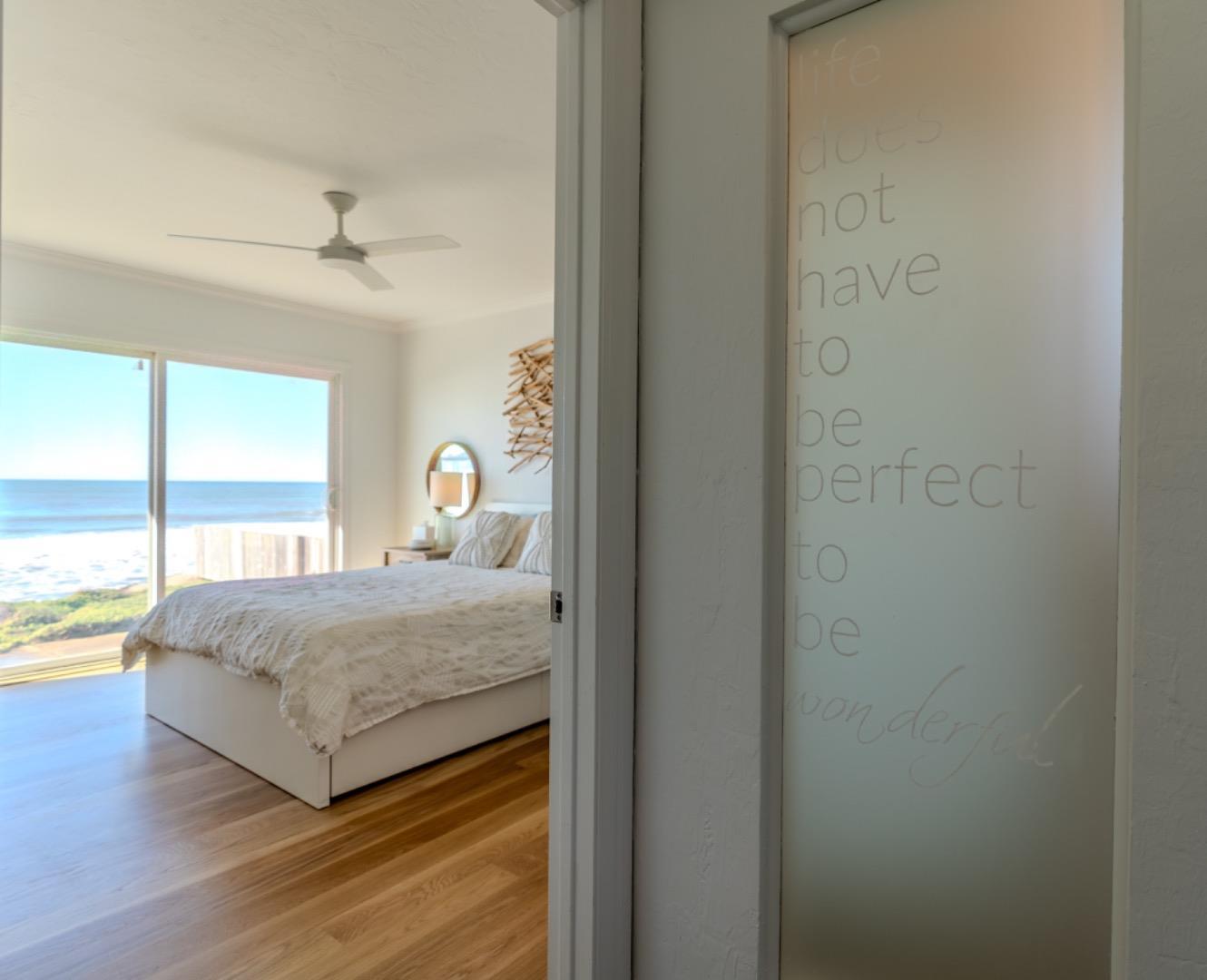 236 Shoreview Avenue Pacifica, CA 94044 - Photo 31 of 61 a bedroom with a bed and a large window