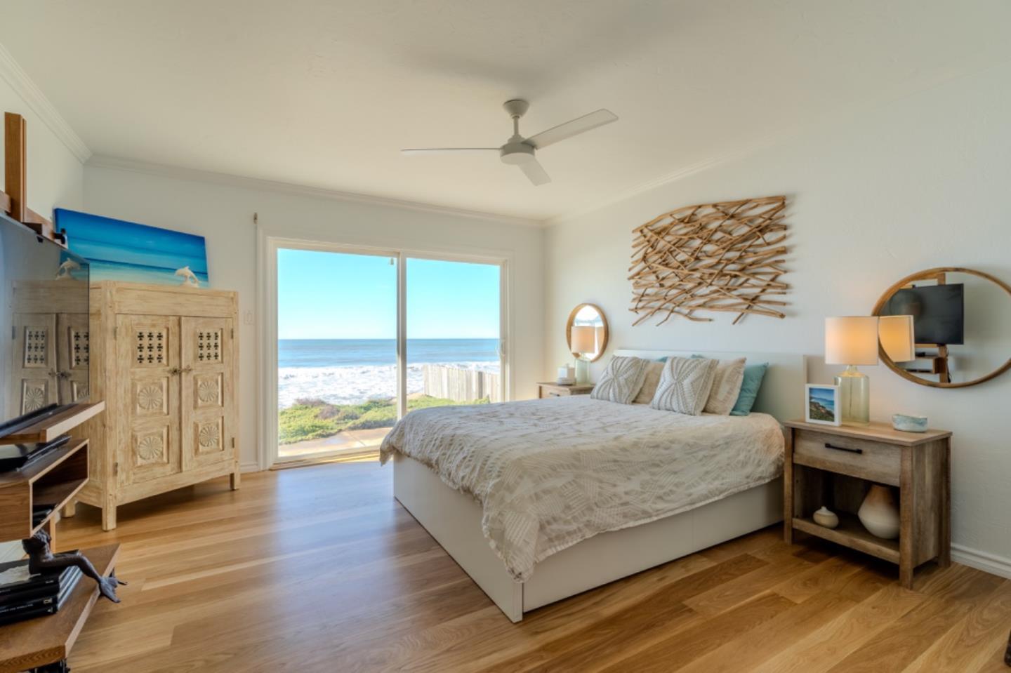 236 Shoreview Avenue Pacifica, CA 94044 - Photo 32 of 61 a bedroom with a bed a fireplace and a large window