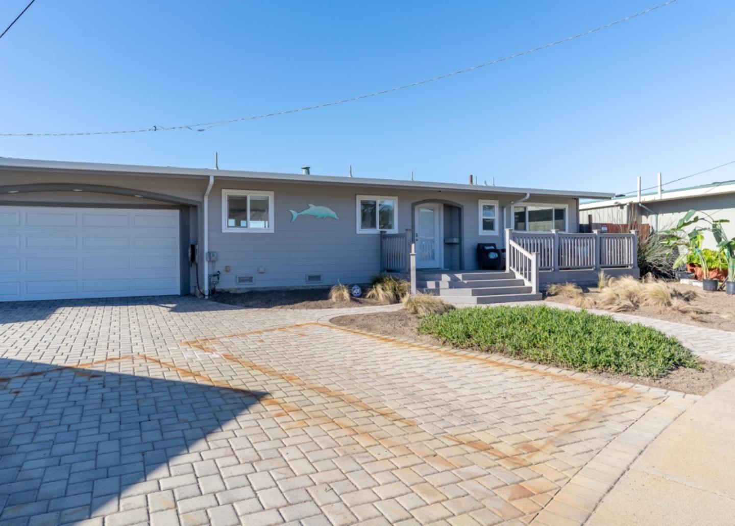 236 Shoreview Avenue Pacifica, CA 94044 - Photo 4 of 61 a front view of a house with a yard and garage