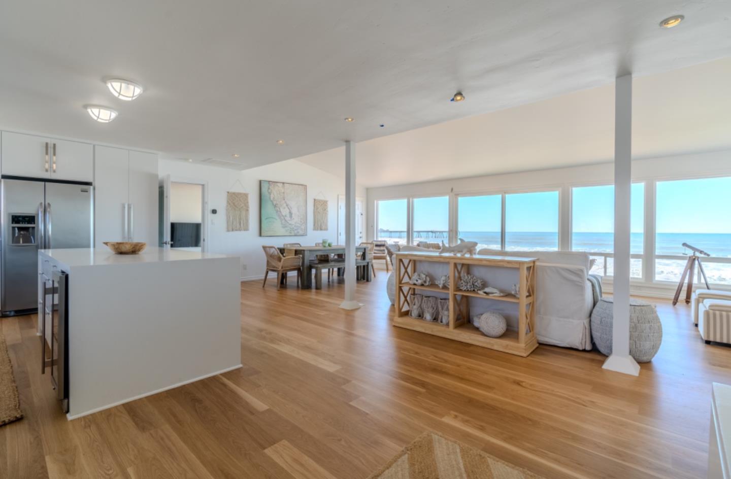 236 Shoreview Avenue Pacifica, CA 94044 - Photo 9 of 61 a living room with furniture wooden floor and a large window