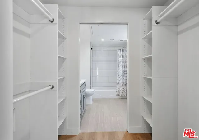 a bathroom with a bathtub and shower
