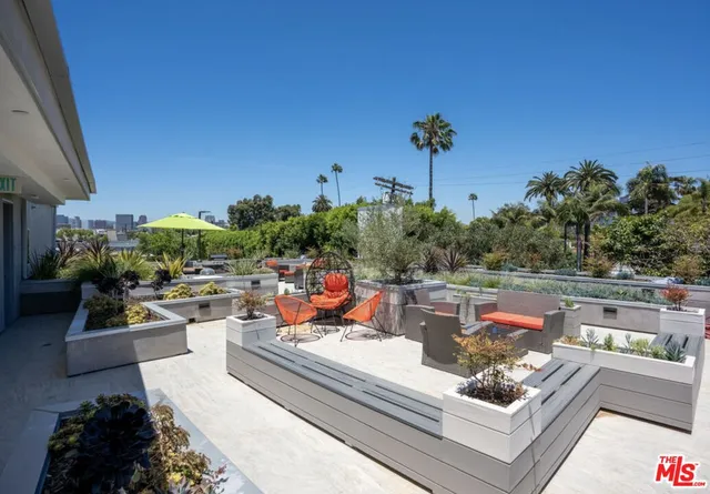 a view of a backyard with sitting area