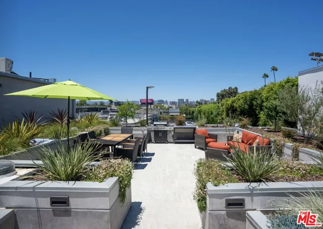 a view of a terrace with sitting area