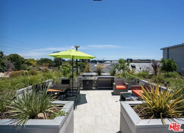 a view of a backyard with sitting area